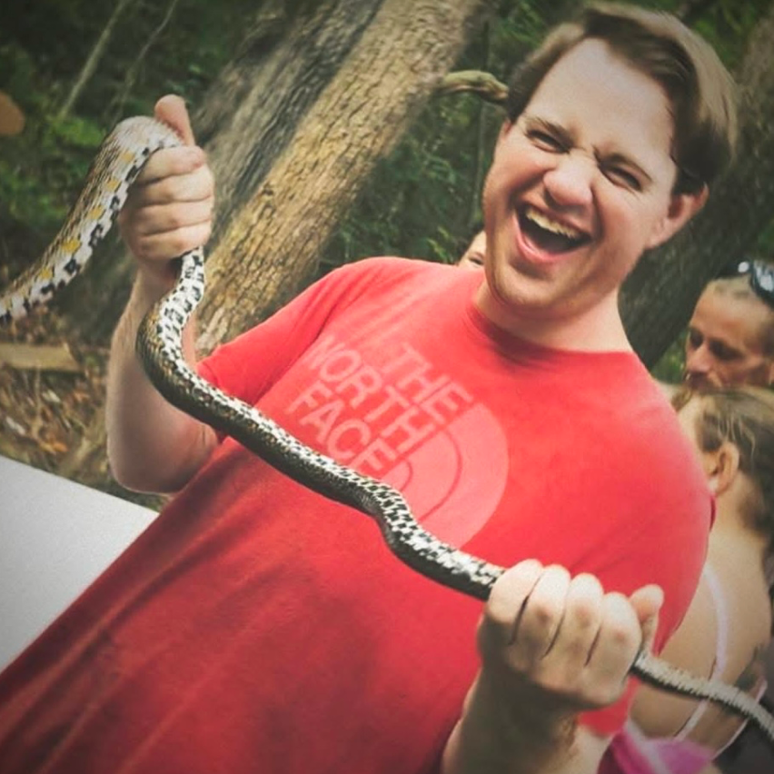 William holding a snake